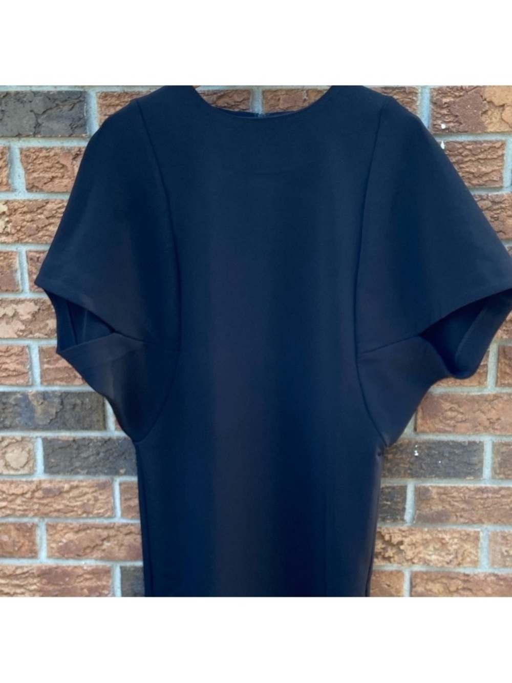 Elegant Black Dress with Sculpted Sleeves and Pencil-Skirt Hem